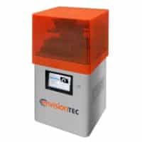 The EnvisionTEC Vida Desktop printer with a grey chassis and an amber UV protective cover.