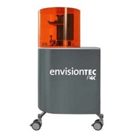 EnvisionTEC Perfactory P4K Series 3D printer with a grey chassis and an orange UV hood.