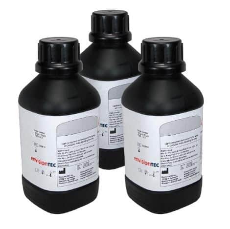 Three bottles of EnvisionTEC resin with a white label.